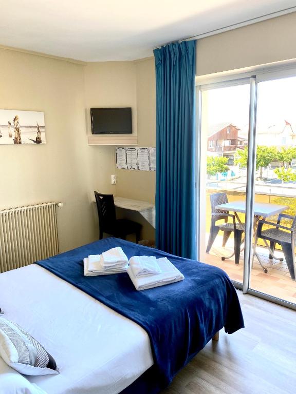Postel nebo postele na pokoji v ubytování Hôtel Le Plaisance