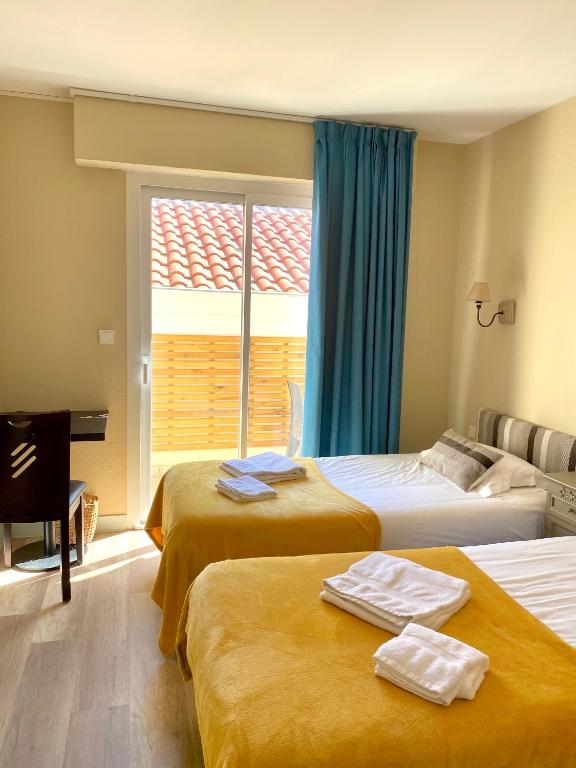 Postel nebo postele na pokoji v ubytování Hôtel Le Plaisance