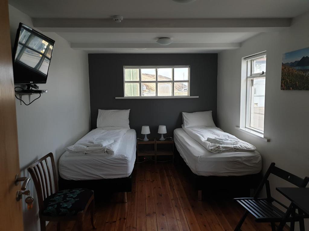 Rúm í herbergi á Grand-Inn Bar and Bed