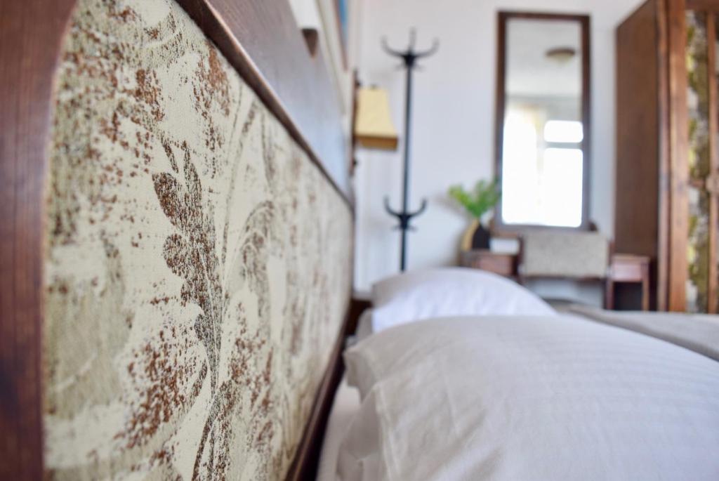 A bed or beds in a room at Family Hotel Apolonia