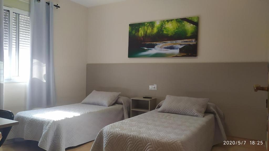 Posteľ alebo postele v izbe v ubytovaní Las Rosas