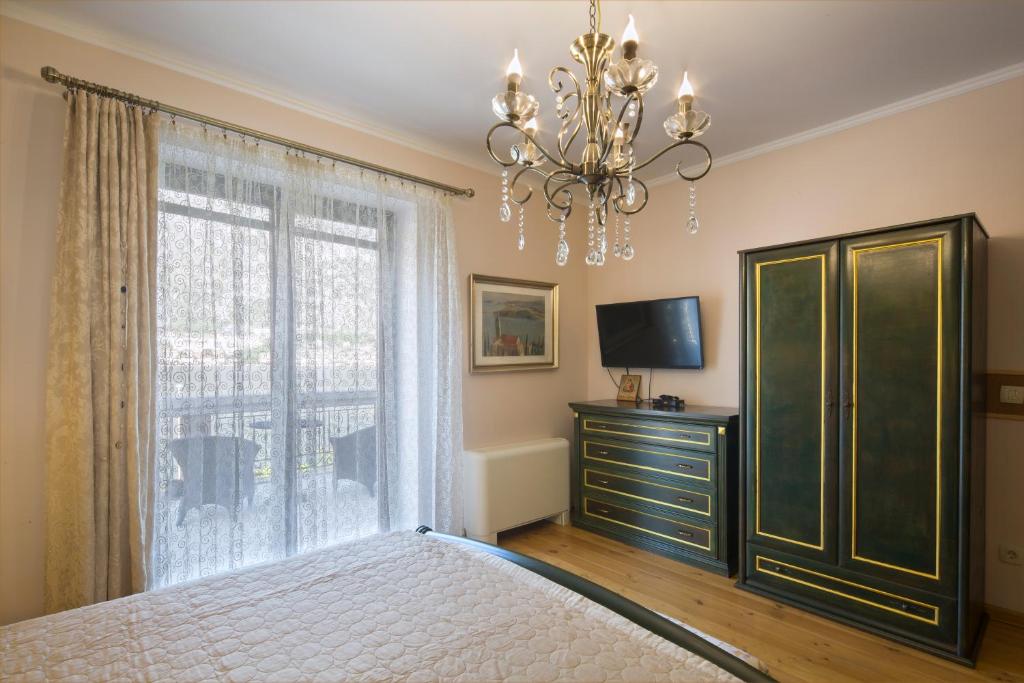TV a/nebo společenská místnost v ubytování Palazzo Banicevic Luxury Rooms