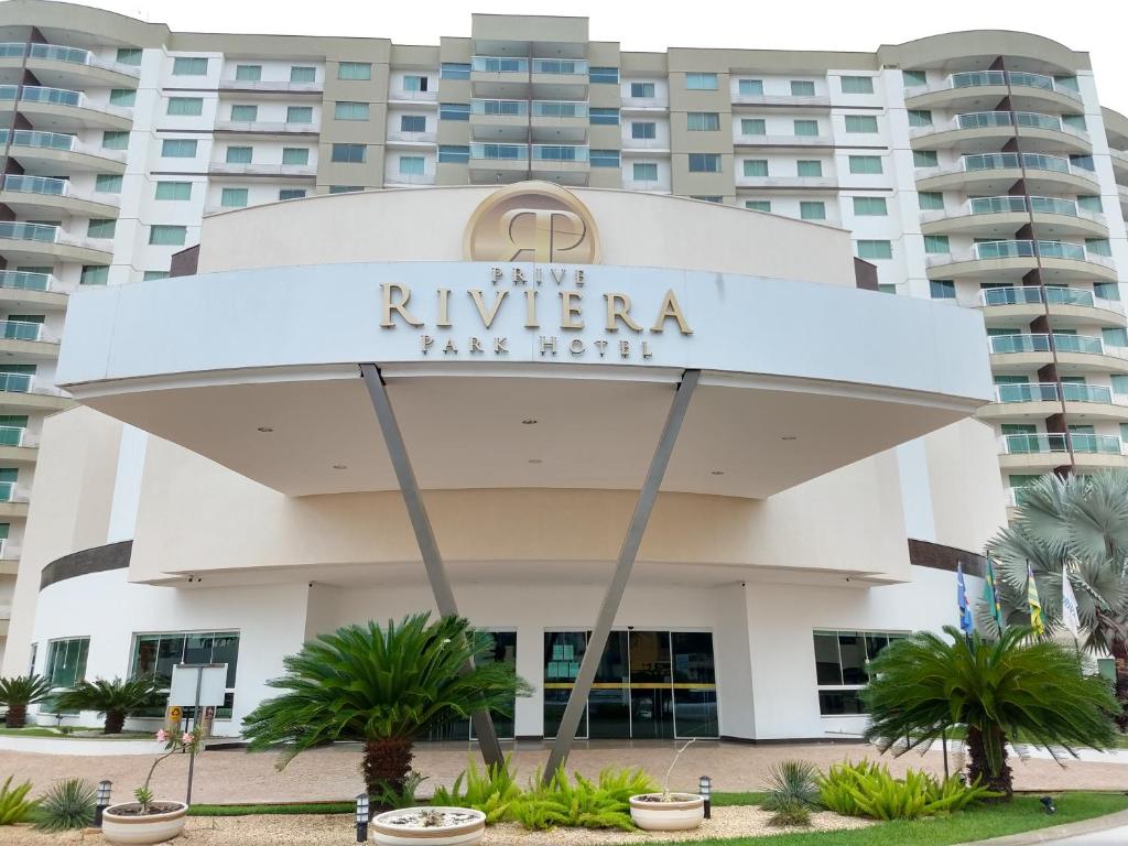 a building with a sign that reads riviera inn north at Prive Riviera - Apartamentos JN in Caldas Novas