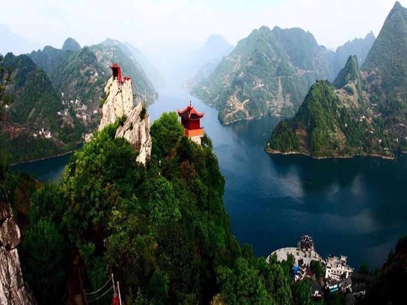 a view of a mountain with a body of water at 7Days Inn Changyang Qingjiang Yichang Gallery in Yichang