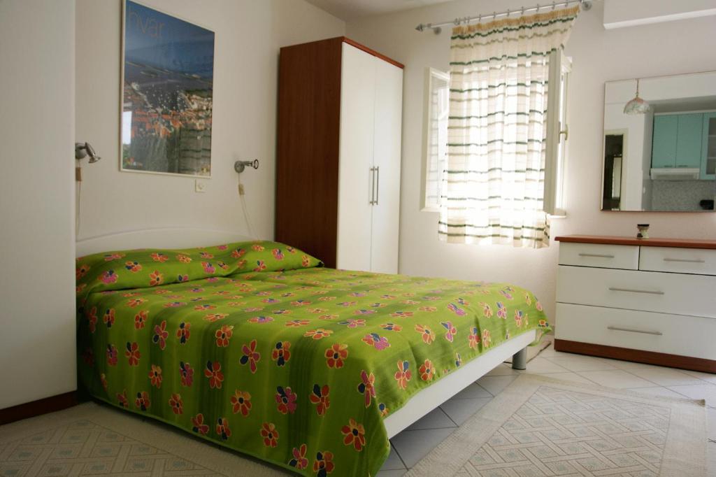 Postel nebo postele na pokoji v ubytování Apartments Viskovic Margita
