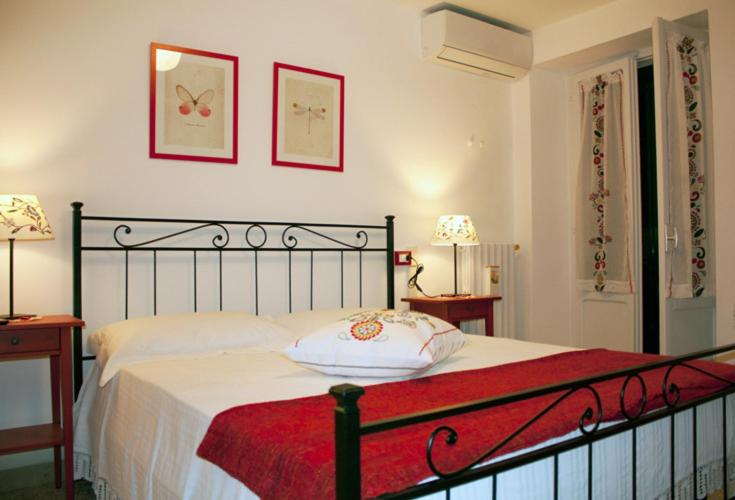 Postel nebo postele na pokoji v ubytování B&B Il Lauro