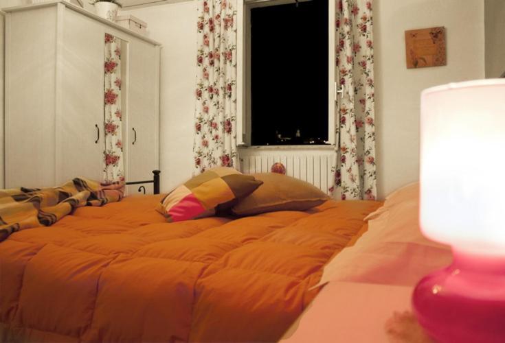 Postel nebo postele na pokoji v ubytování B&B Il Lauro