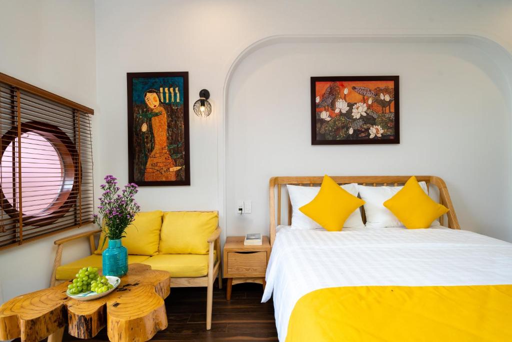 Postel nebo postele na pokoji v ubytování An Nhien Boutique Villa