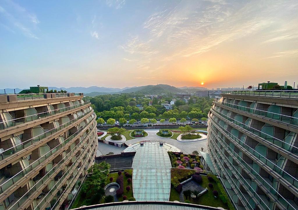 a view of a city from between two buildings at Wyndham Grand Plaza Royale Hangzhou in Hangzhou