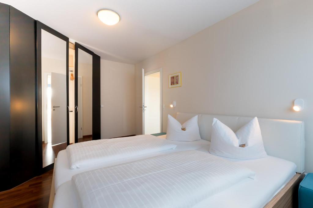 Postel nebo postele na pokoji v ubytování Hotel Gästehaus Zürn