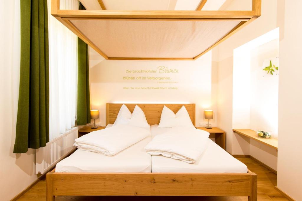 Postel nebo postele na pokoji v ubytování Himmlisch Urlauben Söchau