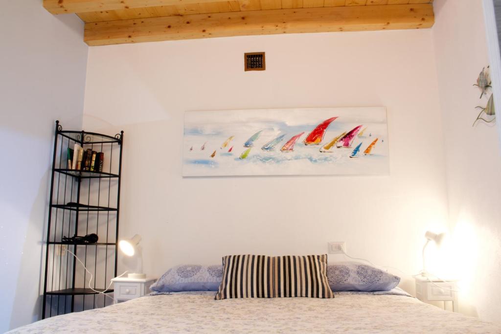 Postel nebo postele na pokoji v ubytování LA MAGNOLIA Guests House