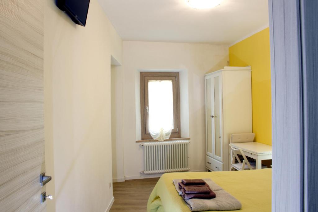 Postel nebo postele na pokoji v ubytování LA MAGNOLIA Guests House