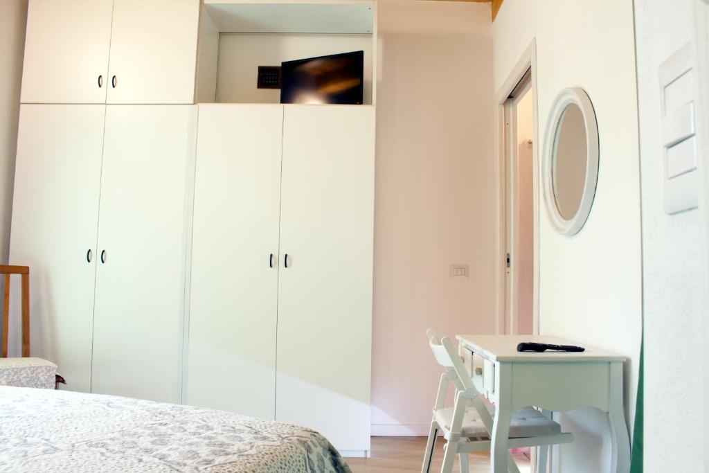 Postel nebo postele na pokoji v ubytování LA MAGNOLIA Guests House