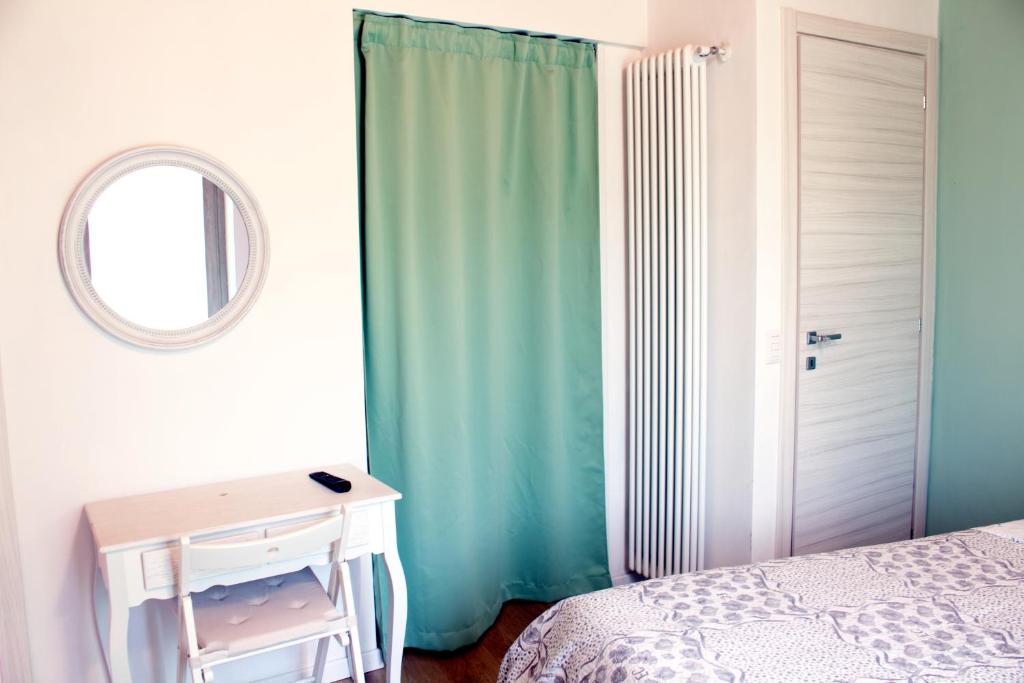 Postel nebo postele na pokoji v ubytování LA MAGNOLIA Guests House