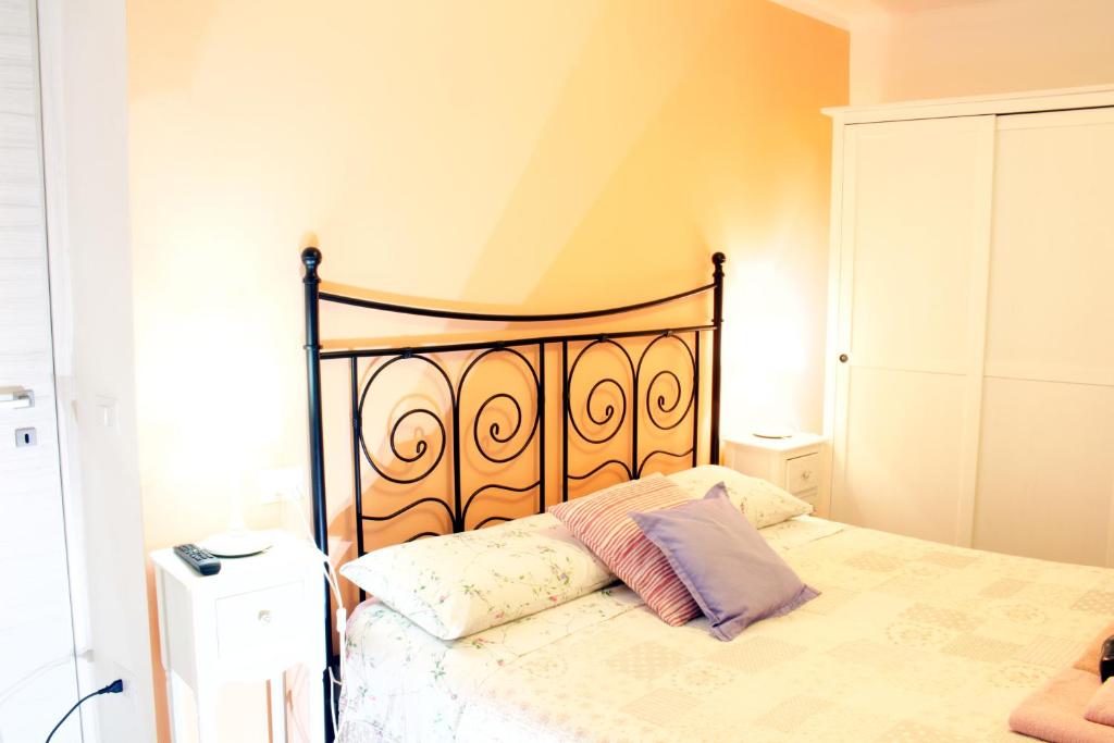 Postel nebo postele na pokoji v ubytování LA MAGNOLIA Guests House