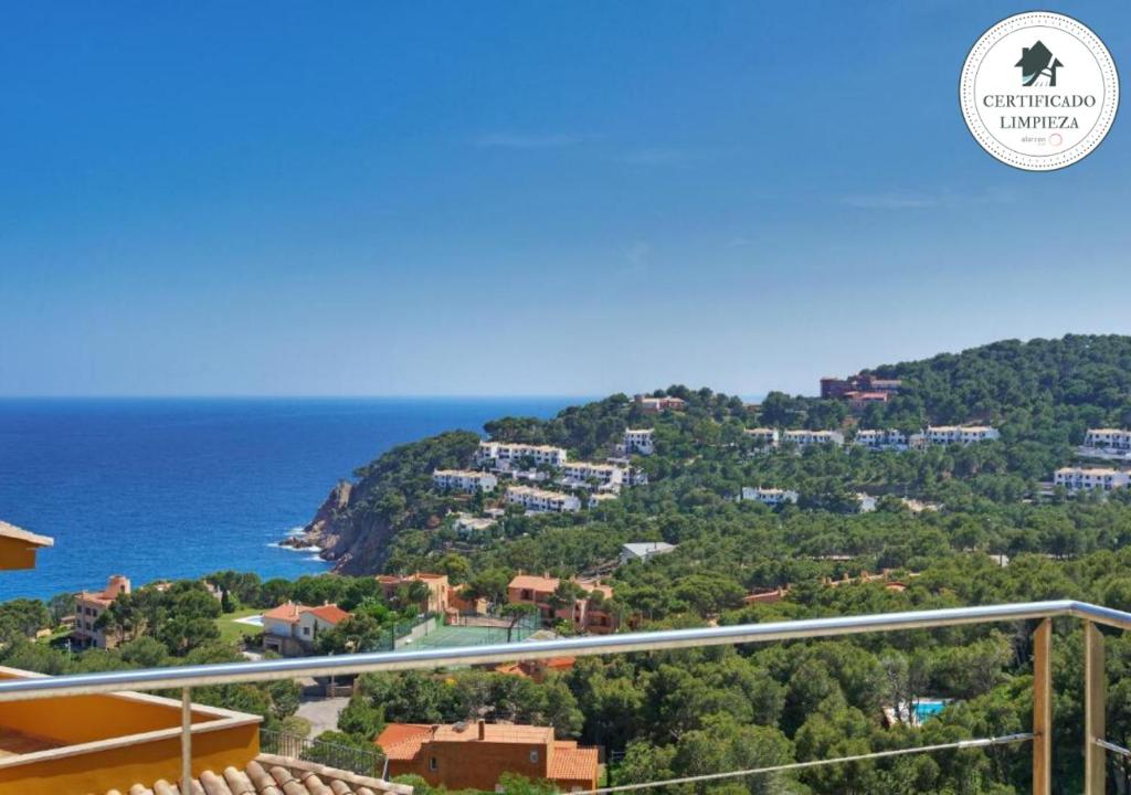 a view of the ocean from the balcony of a house at Naranja in Tamariu