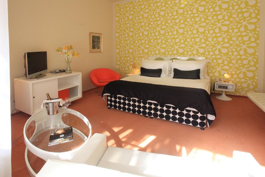Postel nebo postele na pokoji v ubytování LH Vintage Design Hotel Sax