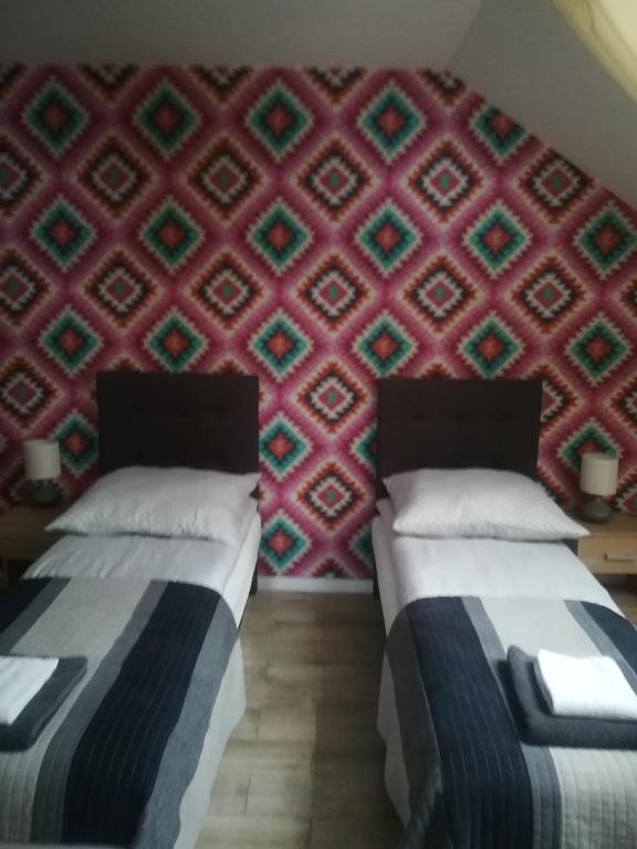 Posteľ alebo postele v izbe v ubytovaní Apart-noclegi