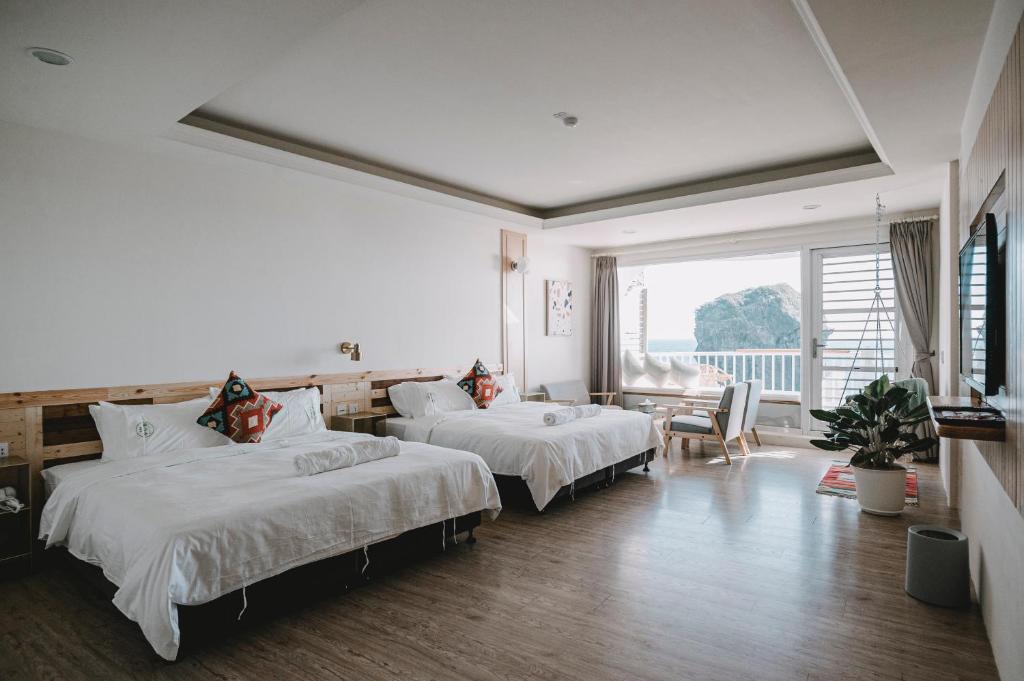 Katil atau katil-katil dalam bilik di Yellow's Kenting B&B II
