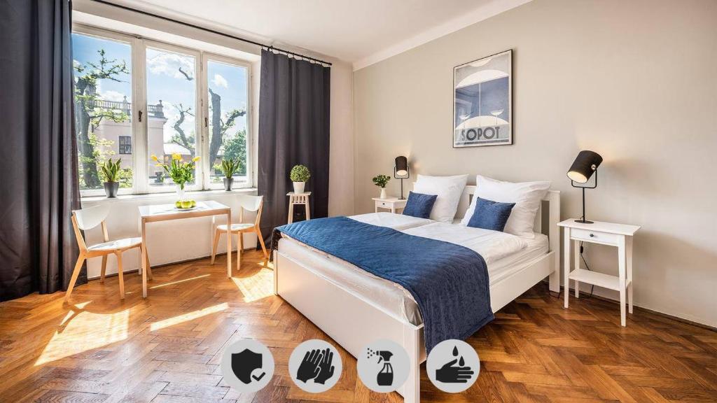 Łóżko lub łóżka w pokoju w obiekcie Sereno Apartments