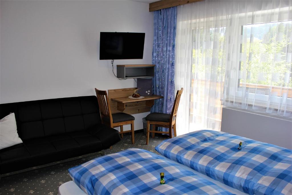 Postel nebo postele na pokoji v ubytování Gästehaus Oberauer