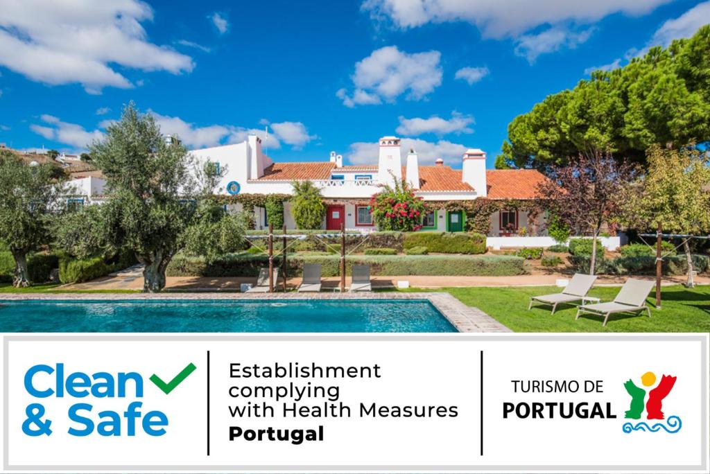 a home with a swimming pool and a house at Casas de Juromenha in Juromenha