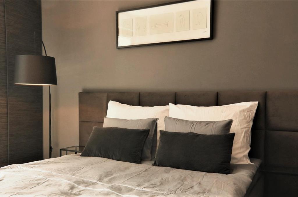 Posteľ alebo postele v izbe v ubytovaní LupoApartments Marea Dostęp na Kod