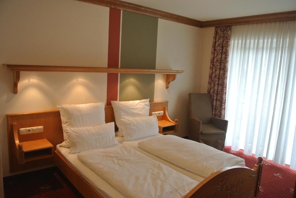 Postel nebo postele na pokoji v ubytování Hotel Jägerhof