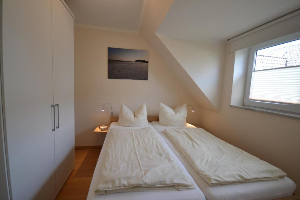 Postel nebo postele na pokoji v ubytování Haus Sir Henry