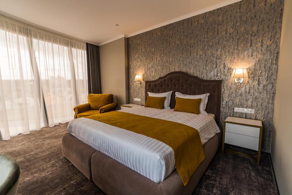 Postel nebo postele na pokoji v ubytování Hotel Aventus