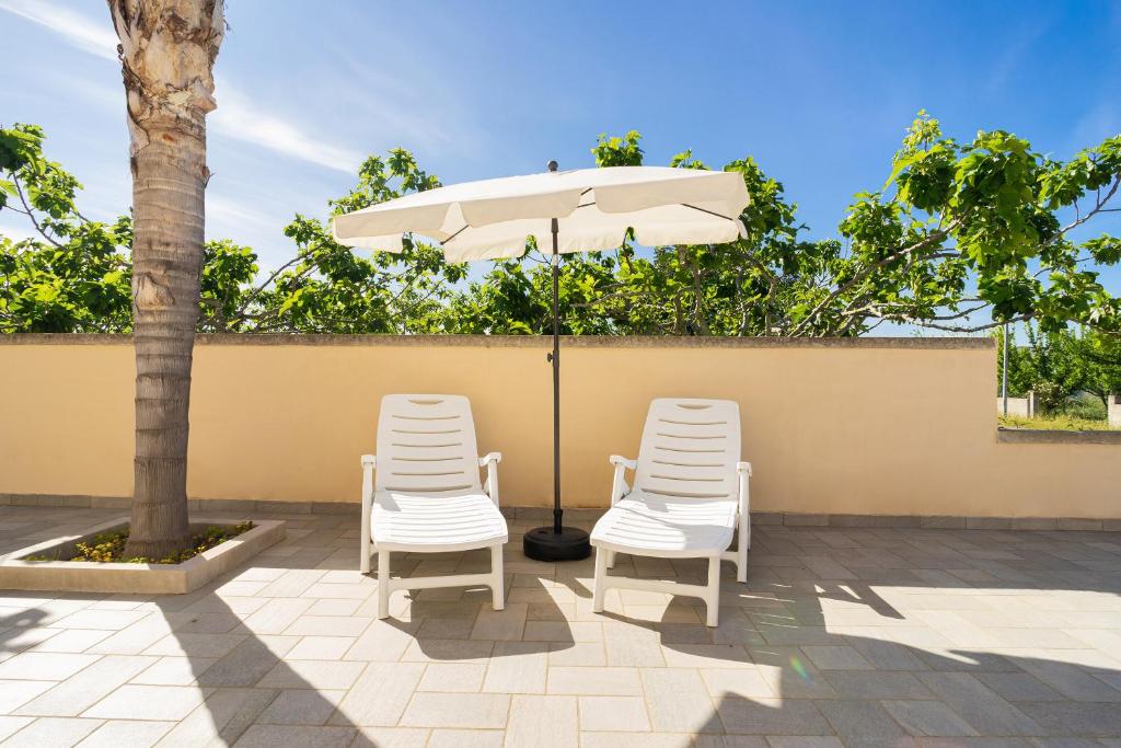 Fotografie z fotogalerie ubytování Intera villa ad uso esclusivo con 2 bagni 4 camere da letto,garage,giardino,area fitness,lavatrice,wifi v destinaci Tuglie