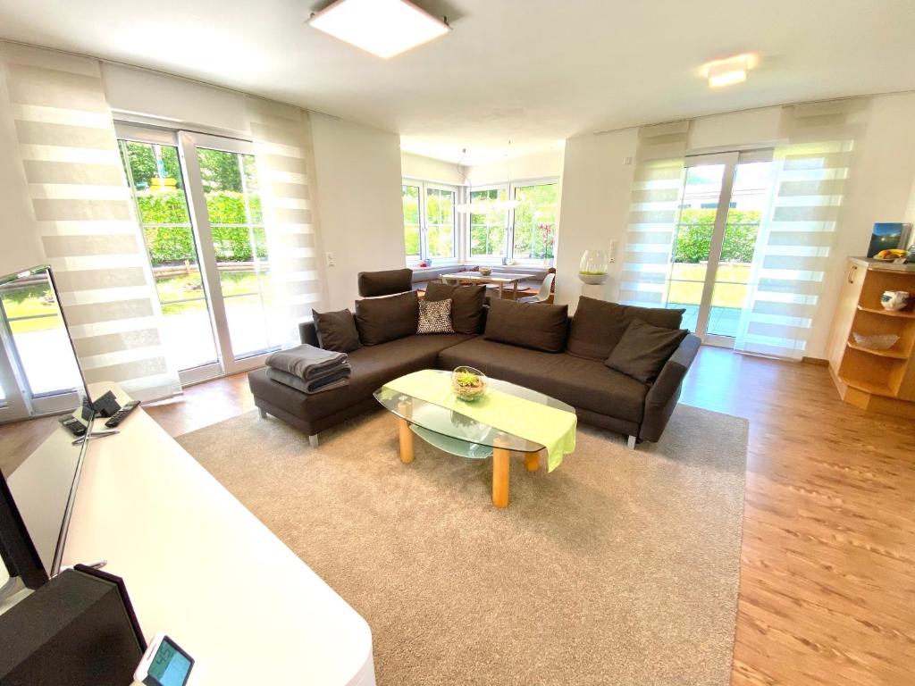 a living room with a couch and a coffee table at Ferienwohnung Winklmoos in Schönau am Königssee