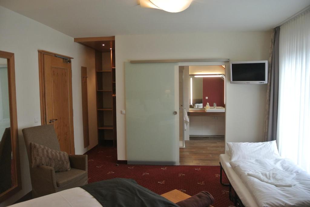 TV a/nebo společenská místnost v ubytování Hotel Jägerhof