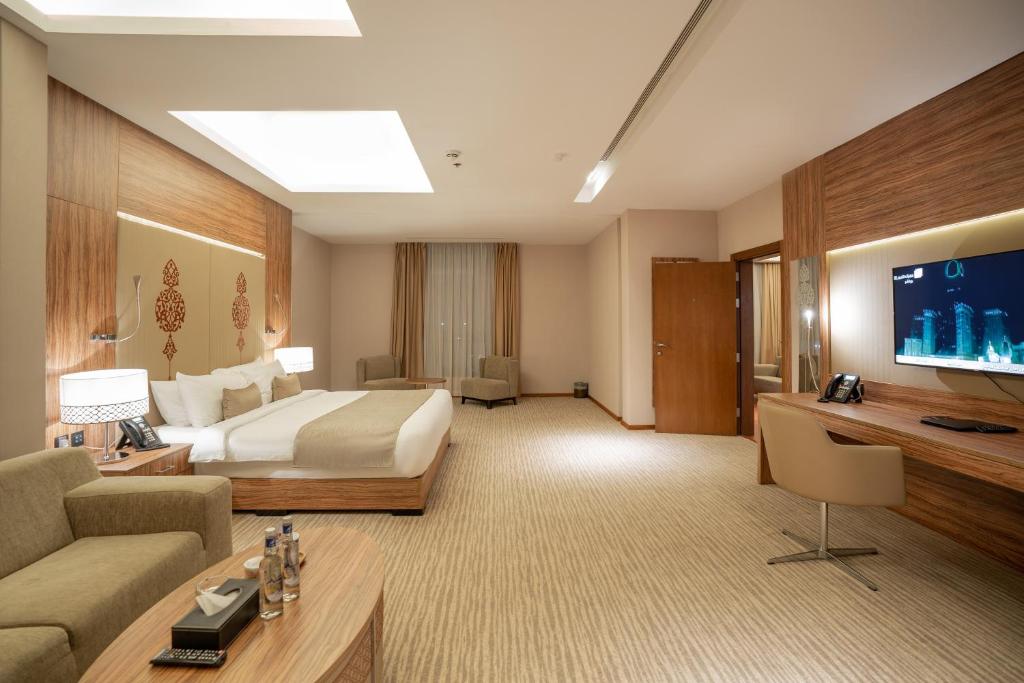 TV a/nebo společenská místnost v ubytování V Boutique Hotel