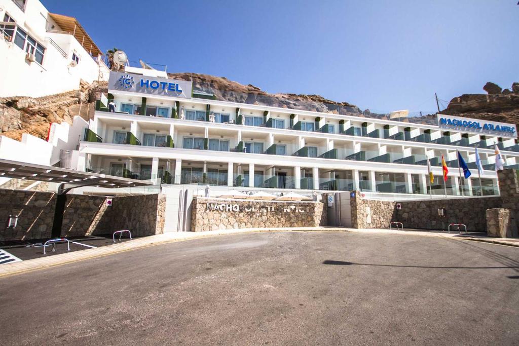 a hotel building with a road in front of it at IG Nachosol Atlantic & Yaizasol by Servatur - Adults Only in Puerto Rico de Gran Canaria