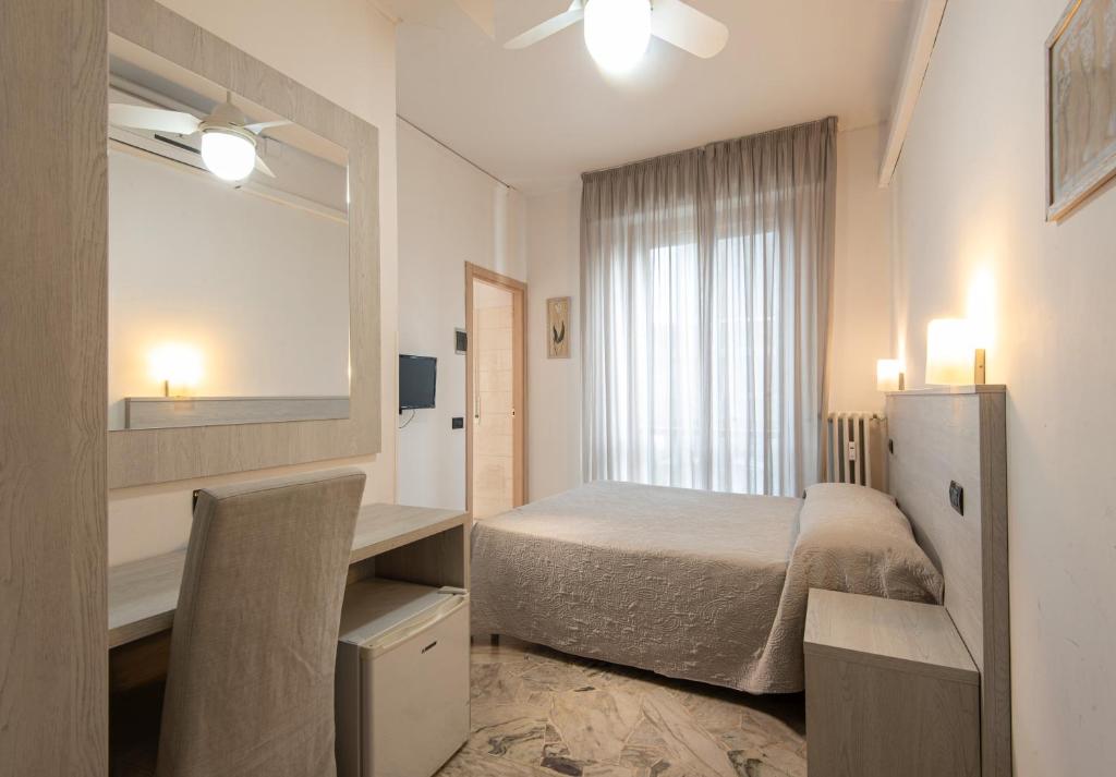 A bed or beds in a room at Hotel Careggi