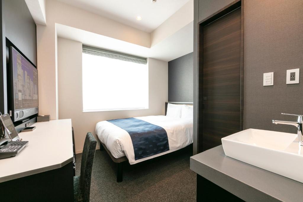 三交インGrande名古屋 -HOTEL & SPA-にあるベッド