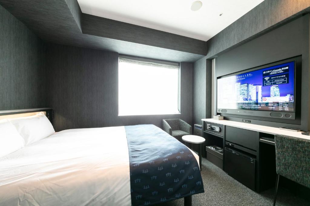三交インGrande名古屋 -HOTEL & SPA-にあるベッド