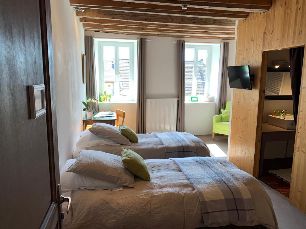 Postel nebo postele na pokoji v ubytování La Colonie - Maison d'Hôtes