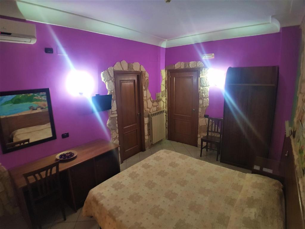 Letto o letti in una camera di Hotel Ginevra