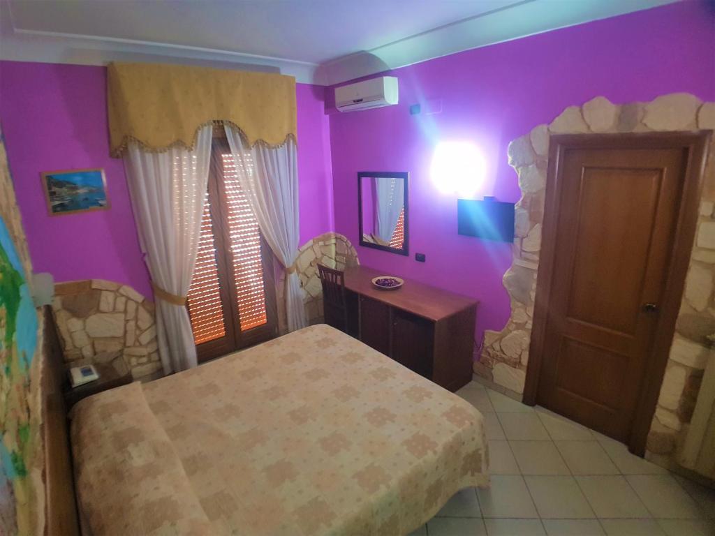 Letto o letti in una camera di Hotel Ginevra