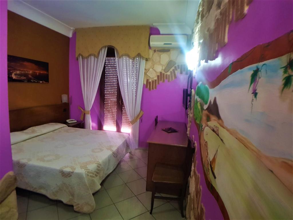 Letto o letti in una camera di Hotel Ginevra