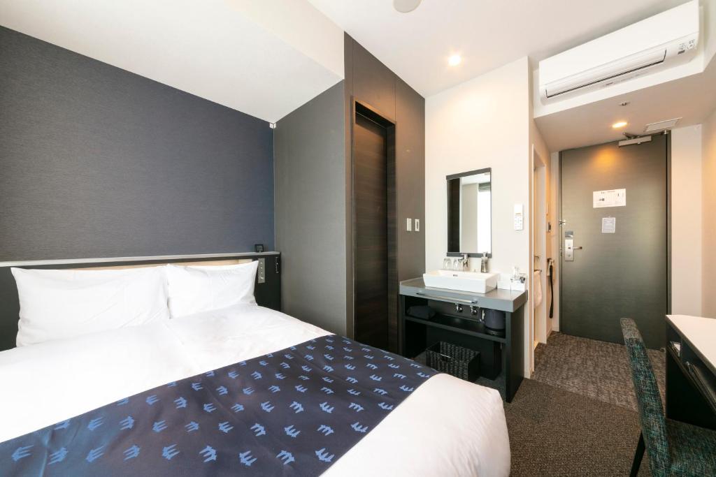 三交インGrande名古屋 -HOTEL & SPA-にあるベッド