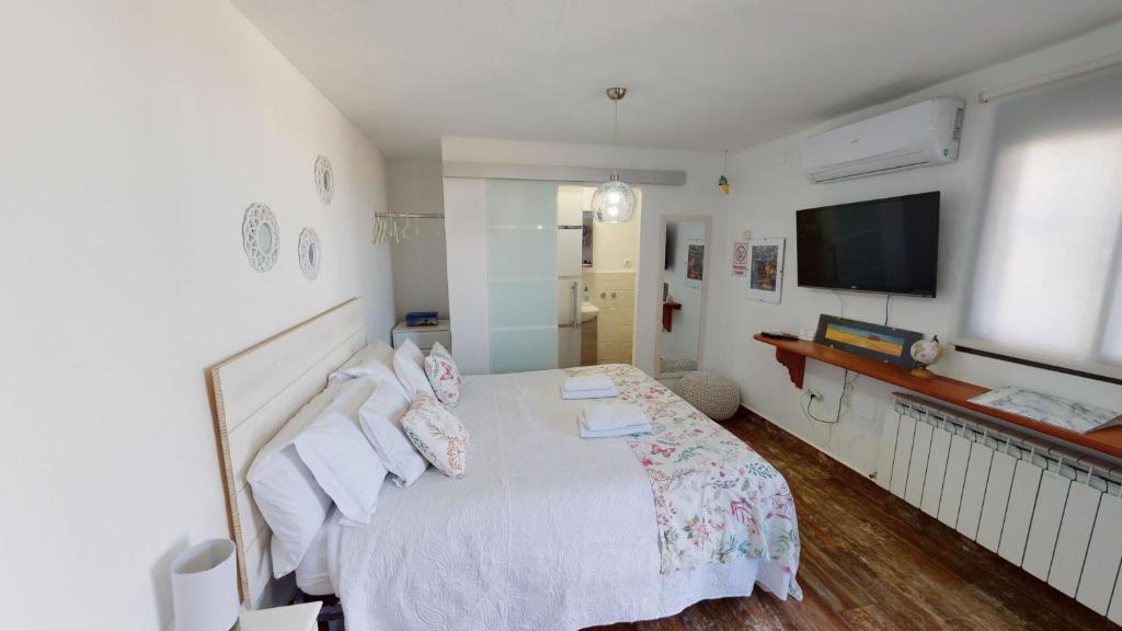 Cama o camas de una habitación en Apartamentos Oncemolinos con desayuno