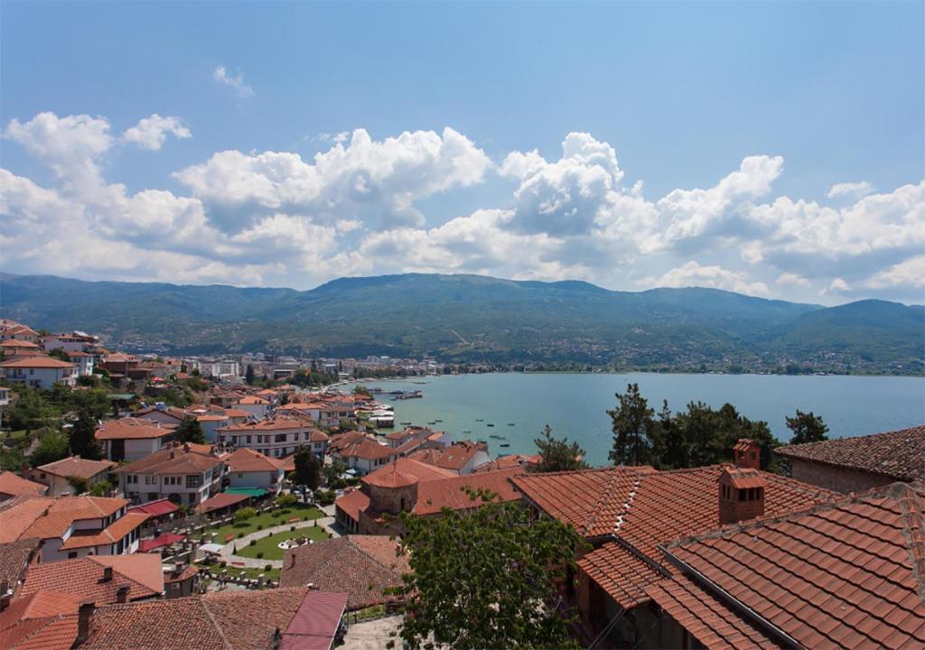 a view of a town with a lake and mountains at Vero Comfort Apartment in Ohrid