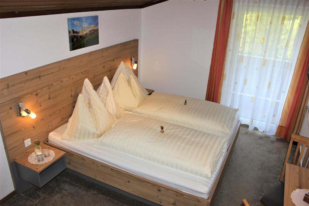 Postel nebo postele na pokoji v ubytování Gästehaus Oberauer