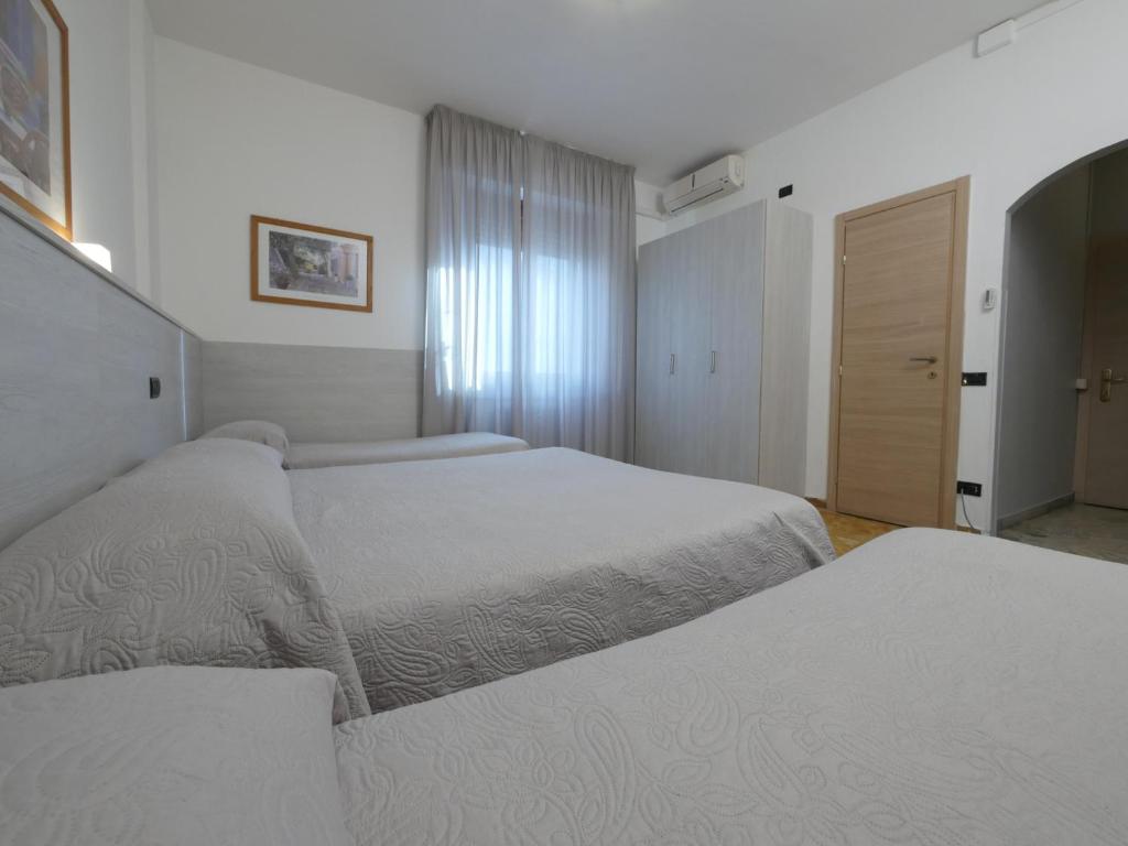 A bed or beds in a room at Hotel Careggi