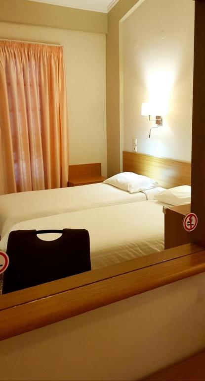 Postel nebo postele na pokoji v ubytování Castella Beach