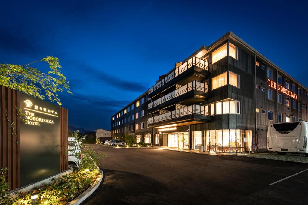 a large building with a street in front of it at Hotel Noborisaka in Fujikawaguchiko